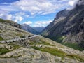 A scenic roadway cutting through mountains in Norway