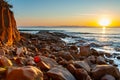 Scenic rocky beach Cala Violina landscape at the sunset. The sun is going down behind the horizon. Tyrrhenian Sea bay at the Royalty Free Stock Photo