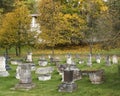 Old churchyard with tombstones in Holy Dormition monastery. Ancient gravestones with stone carvings