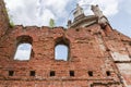 Ruins of old palace, partially destroyed brick wall and tower