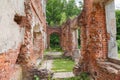 Ruins of old palace, partially destroyed brick walls of corridor