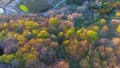 Scenic rural drive amid trees with stunning autumn colors.