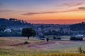 Scenic rural landscape at sunset with fields and trees. Royalty Free Stock Photo
