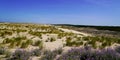 Scenic sand dunes panoramic on bright summer day in Le Porge ocean beach Royalty Free Stock Photo