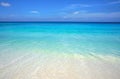 Scenic seascape of azure transparent ocean water and blue sky. Tropical beach with white sand. Idyllic scenery of seaside resort. Royalty Free Stock Photo