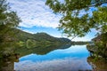 Scenic seaside of lake Schliersee on a sunny day with blue sky in Bavaria, Germany Royalty Free Stock Photo