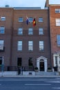 Scenic shot of the Australian Embassy building in Dublin, Ireland, with the Aboriginal flag"