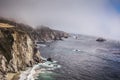 Scenic shot of the beautiful Big Sur Coast of California on a misty day, United States of America aka USA. Foamy waves in the Royalty Free Stock Photo