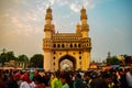 Scenic shot of the Charminar in the background of a huge crowd in Hyderabad