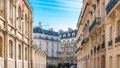 Scenic shot of multiple residential buildings in Batignolles, Paris under the blue sky