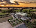 Scenic shot over Chapel Down Vineyard with the golden evening sunset on the horizon in Tenterden, UK