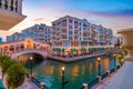 Scenic shot of a river flowing through the Qanat Quartier in Pearl Qatar in the evening