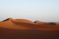 the dunes of wadia desert on the other side of a street