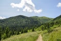 Scenic skyscape with blue sky full of windy clouds, and beautiful green mountains. Carpathians, Ukraine Royalty Free Stock Photo