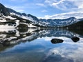 Snow-covered mountains reflecting in the water, Five Polish Ponds Valley