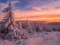 Scenic snowy landscape with a view from a mounatin range to the valley