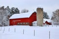 Snowy winter rural landscape with red barn Royalty Free Stock Photo