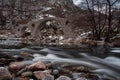 Scenic spring landscape shot in Bulgarian mountain with ancient bridge and smooth river