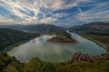 Scenic spring landscape shot in Bulgarian mountain with epic sky and smooth river