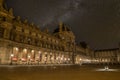 Scenic starry night sky above the Parisian Louvre Palace
