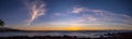 Scenic stitched panorama of a sunset with a dramatic sky over Pacific ocean, Big Island, Hawaii. Royalty Free Stock Photo