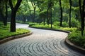 Scenic stone path among tall trees in the park, serene and inviting for a peaceful stroll