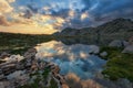 Scenic summer landscape shot in the mountain with clouds reflected in a beautiful lake Royalty Free Stock Photo