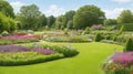 Scenic Summertime View of a Beautiful English-Style Landscape Garden with a Green Mowed Lawn, Leafy Trees, and Colorful Flower Bed