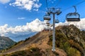 Scenic sunny blue sky landscape of Caucasus mountains with cableway ski lift of Gorky Gorod mountain resort in Sochi