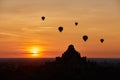 Scenic sunrise with many hot air balloons above Bagan in Myanmar Royalty Free Stock Photo