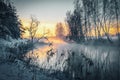 Scenic sunrise over the winter river. Royalty Free Stock Photo