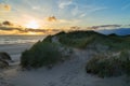 Scenic sunset behind a dune of the North Sea in Denmark Royalty Free Stock Photo