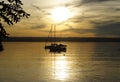 a scenic sunset on lake Ammersee with sailing boats resting on the water (Herrsching on Ammersee in Germany)