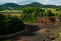 Scenic sunset landscape of catalan region known as Garrotxa in spanish Catalunya region in spring with poppy flowers fields, known