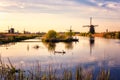 Scenic sunset landscape with windmill and sky, traditional dutch village of mills Kinderdijk, Netherlands Royalty Free Stock Photo