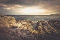 Scenic sunset over rocky sea coast, viewed from cliffs Royalty Free Stock Photo