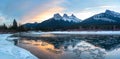 Canadian Rocky Mountain Sunset Colors Reflected in Bow River near Banff National Park cold winter day Royalty Free Stock Photo