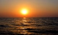 Scenic sunset on the south Sinai beach, sun going down before night at the coast of the red sea in Egypt, the sun rays reflection Royalty Free Stock Photo