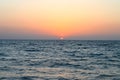 Scenic sunset on the south Sinai beach, sun going down before night at the coast of the red sea in Egypt, the twilight could be Royalty Free Stock Photo