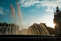 Scenic sunset view of Catalonia Square known as Plaza Catalunya in Barcelona with sun-rays and fountain. Placa Catalunya is a Royalty Free Stock Photo