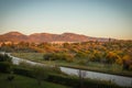 Scenic sunset view of fields and mountains in Alimos in Athens, Greece Royalty Free Stock Photo