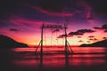 Scenic swings in the sea for a couple of lovers in love with a beautiful sunset