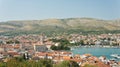 Scenic top view of the city with mountain background, beautiful cityscape, sunny day, Trogir, Dalmatia, Croatia