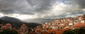 Scenic town with traditional ceramic tile rooftops surrounded by mountains, Arachova Boeotia Greece