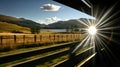 Scenic train view of sunburst over scottish highlands landscape Royalty Free Stock Photo