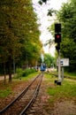 Scenic travel landscape. Diesel locomotive TU7A with several cars departs from the station