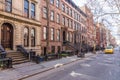 Scenic tree lined street of historic brownstone buildings in the West Village neighborhood of Manhattan in New York City