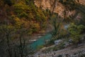 Scenic turquoise river Verdon and a rugged cliff in the Blanc-Martel hiking trail in France