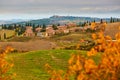 Scenic Tuscan landscape with small village on top of hill Royalty Free Stock Photo