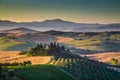 Scenic Tuscany landscape with rolling hills and valleys at sunrise